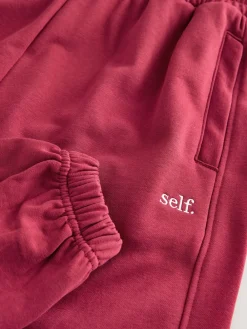 self. Red Cuffed Joggers Online