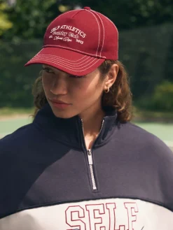 self. Red Slogan Cap Outlet