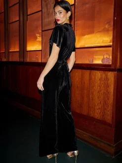 Yumi Black Velvet Jumpsuit With Twist Neckline And Buckle Belt New
